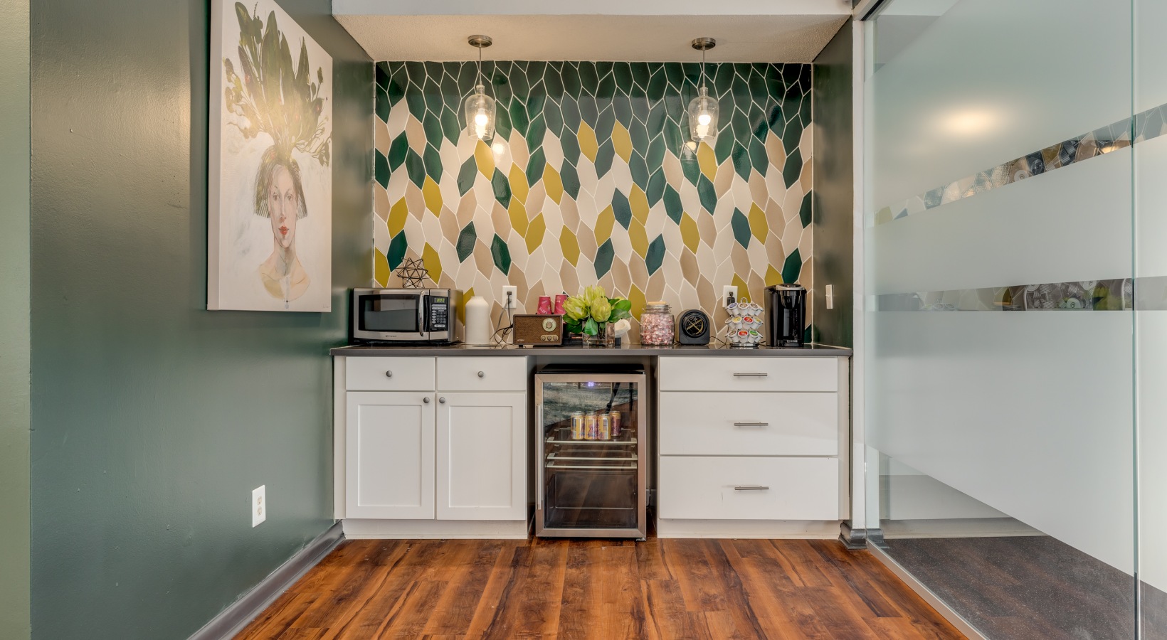a kitchen with a green and yellow wallpaper at The  Quinn on Ravenglass